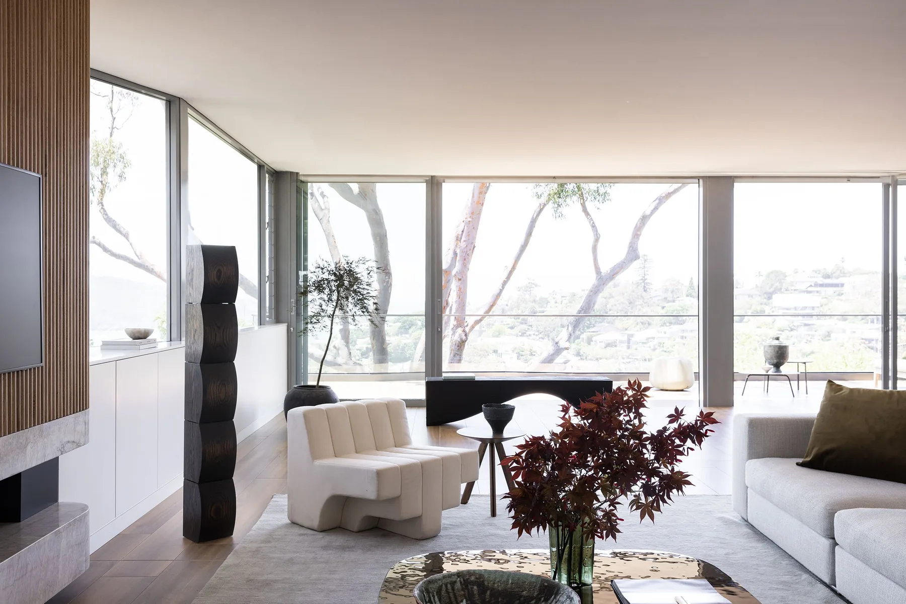 Mosman 02 &mdash; living room with floor-to-ceiling windows and treetop views
