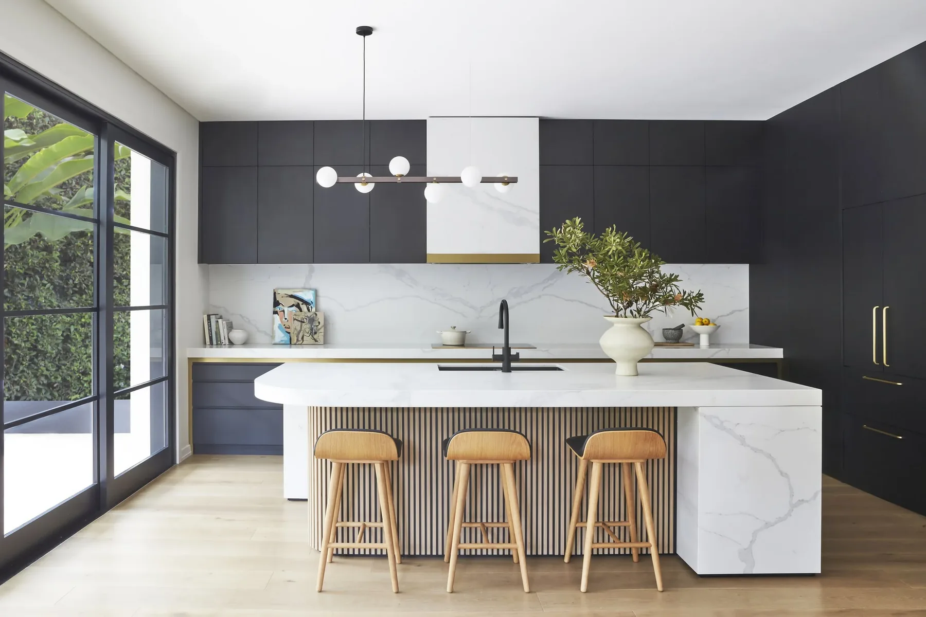 Mosman &mdash; kitchen with dark cabinetry, marble island and timber stools, Lower North Shore