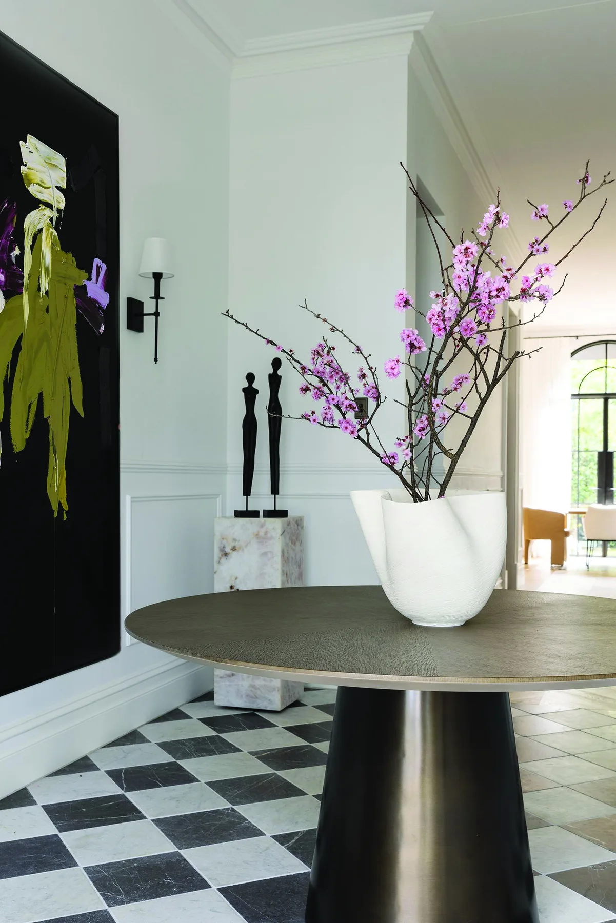Mosman 01 &mdash; entry hall with round bronze table, chequerboard floor and abstract artwork