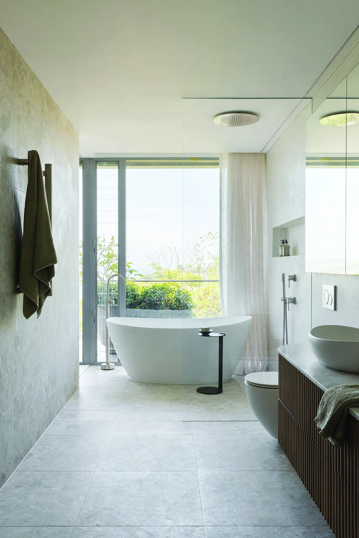 Mosman 02 &mdash; bathroom with freestanding bath, stone floor and garden outlook