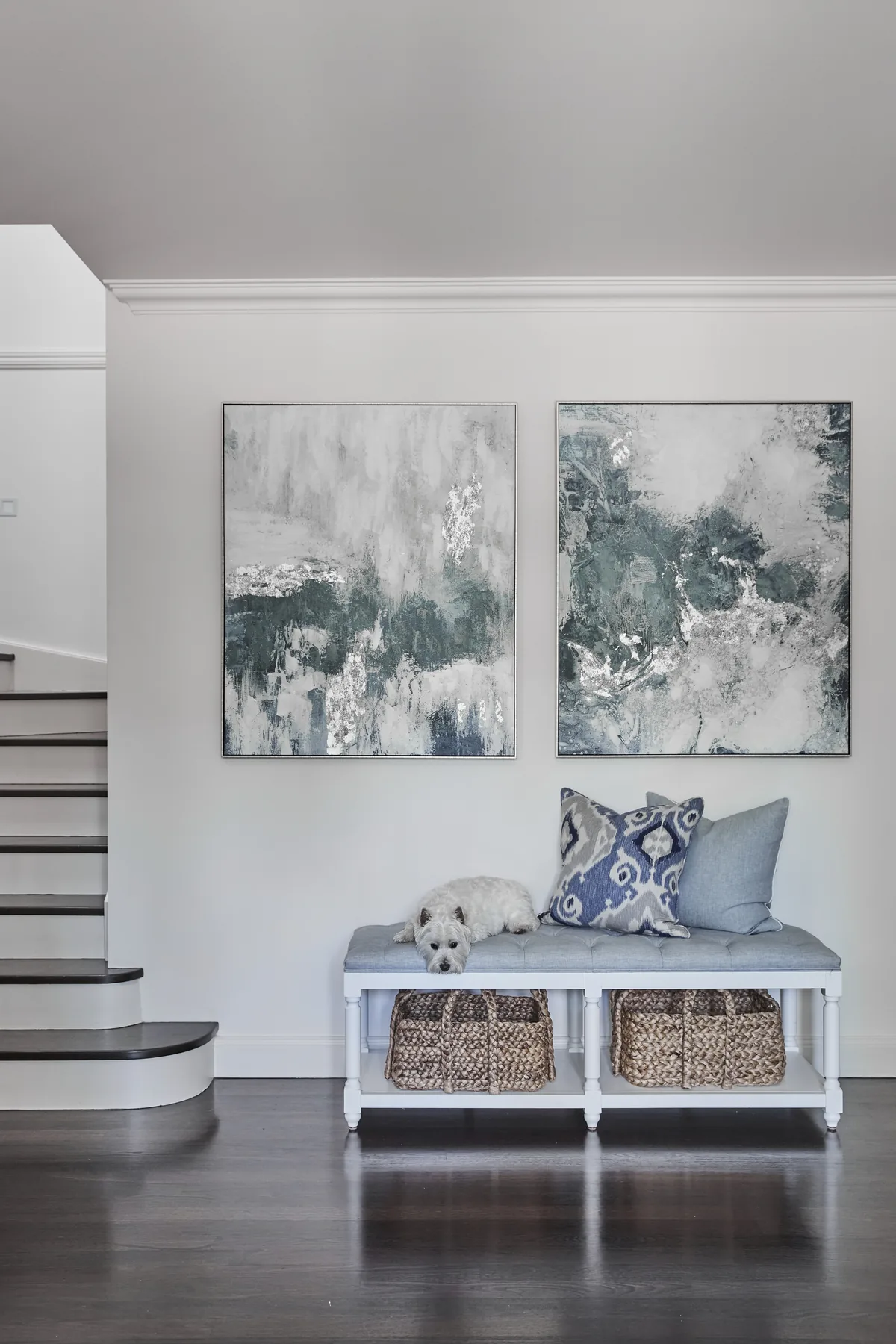 Wahroonga &mdash; entry bench with baskets and a pair of abstract artworks beside the staircase
